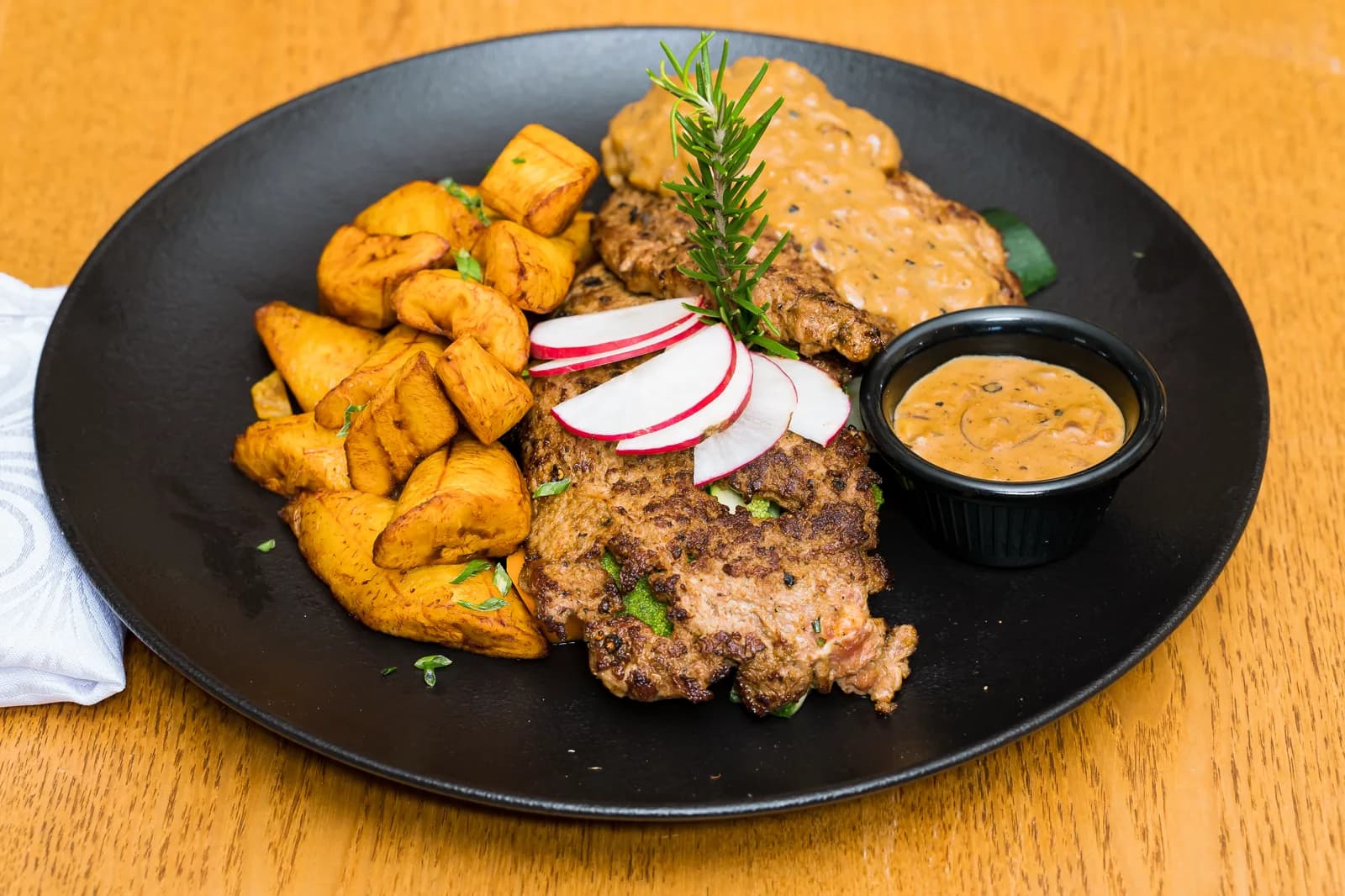 Grilled steak with plantain at the HMK Living restaurant, Kigo Kampala