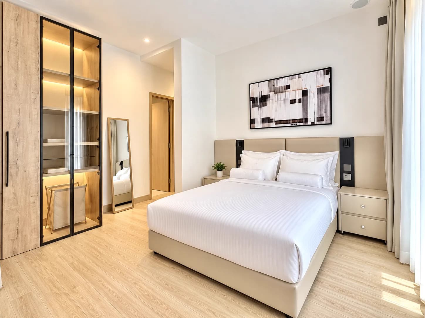 2BHK Suite bedroom with smoked-glass wardrobe, Kigo Kampala