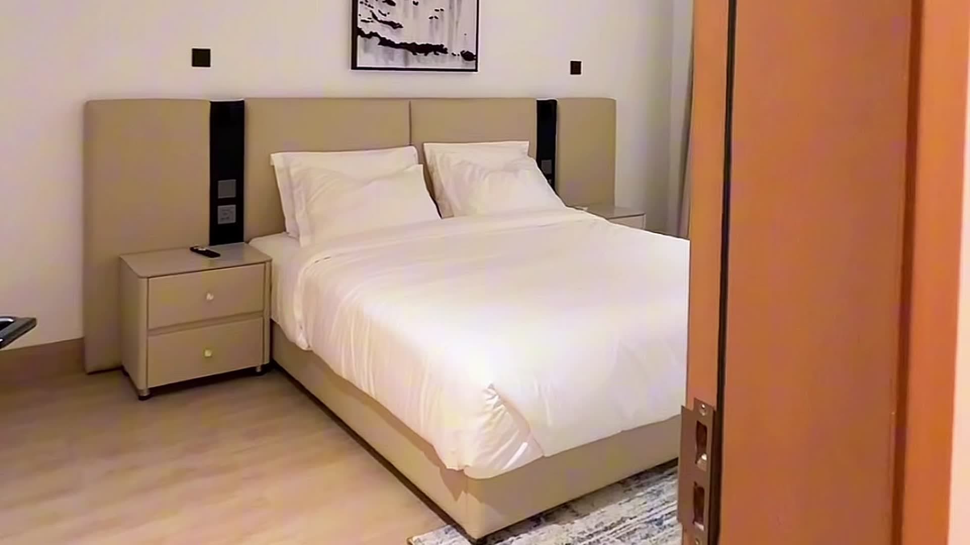 A bed turned down before an early departure at HMK Living, Kigo Kampala